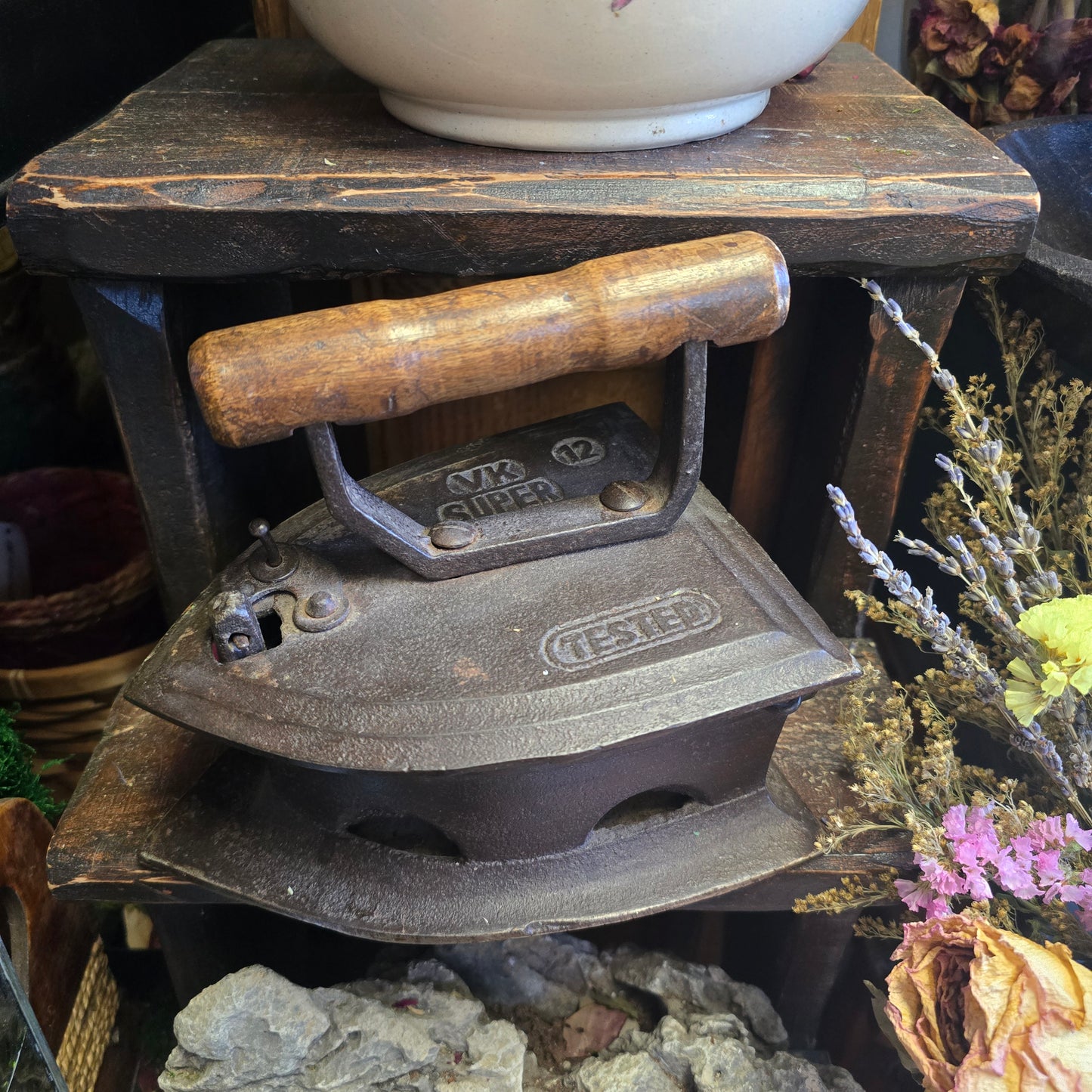 Antique Iron With Dried Flower Arrangement