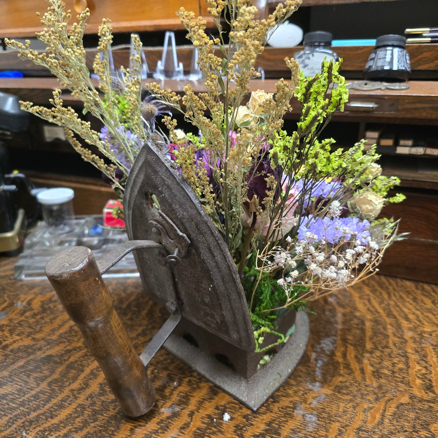 Antique Iron With Dried Flower Arrangement
