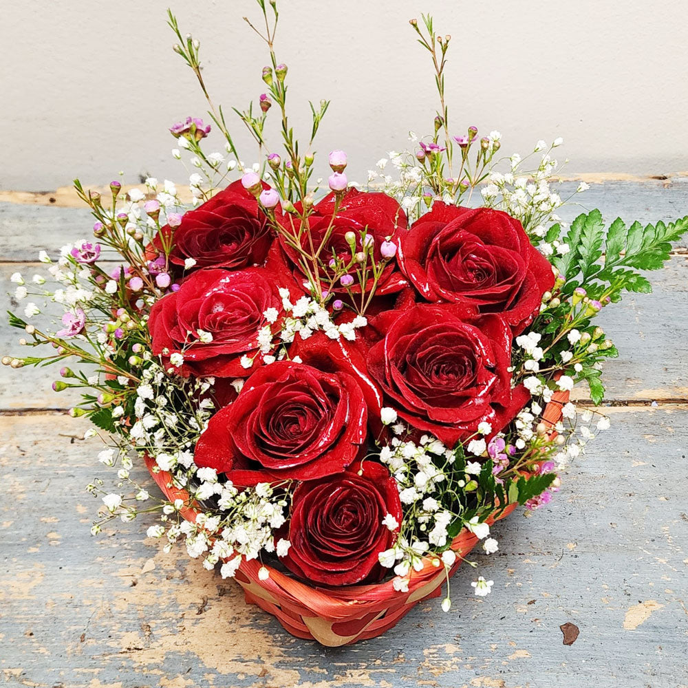7 Roses in Heart Shaped Basket